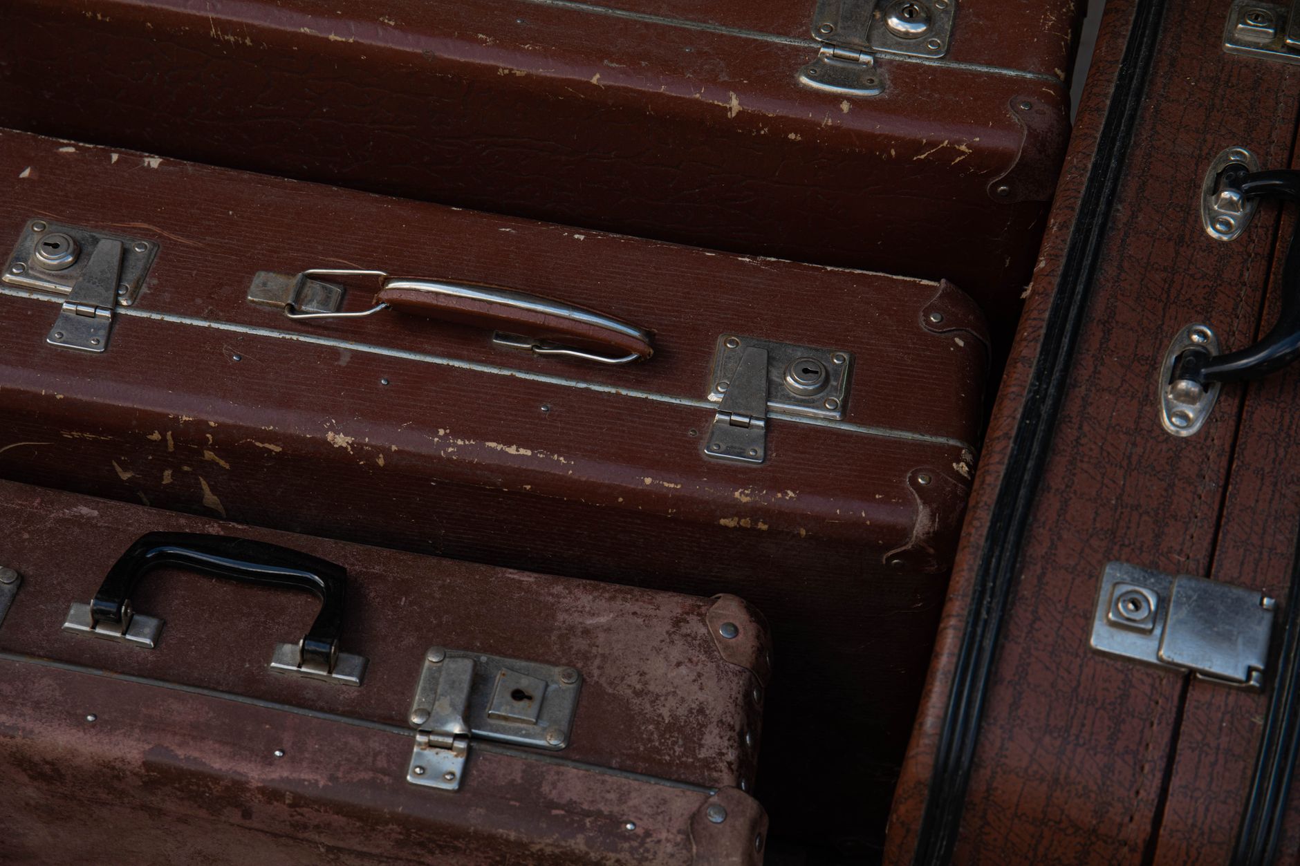 Close-up of suitcase wheels and handle