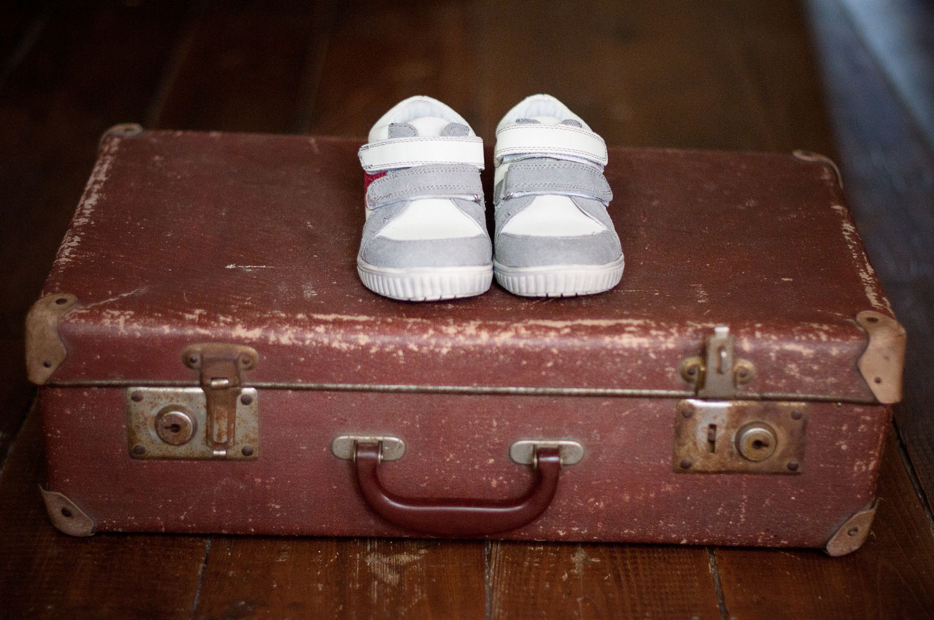 Shoes packed at the edge of a suitcase
