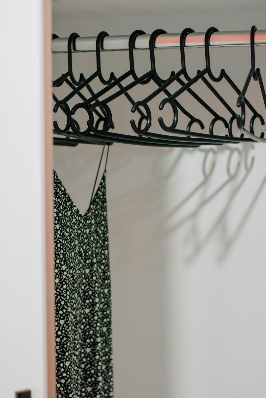 Clothes hanging on a single closet rail