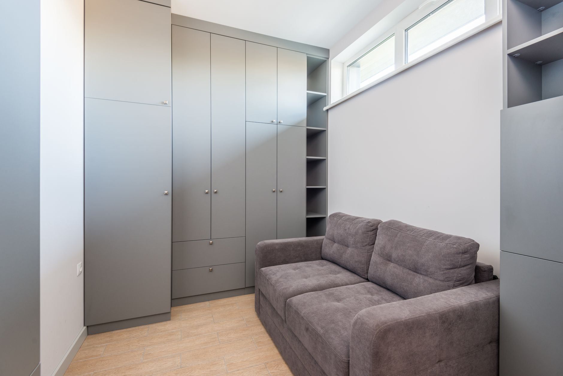 A narrow wardrobe in a small room