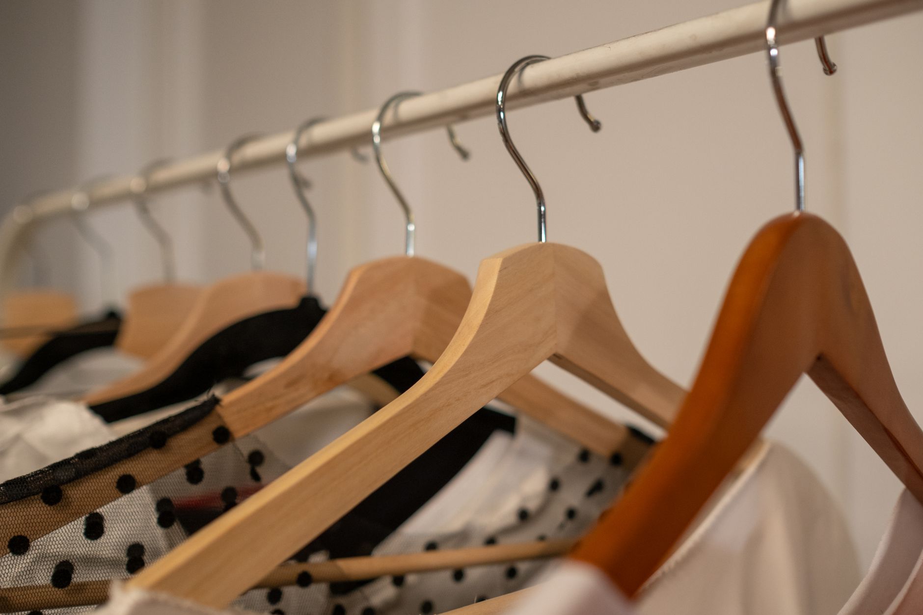 Clothes hanging on a wardrobe rail